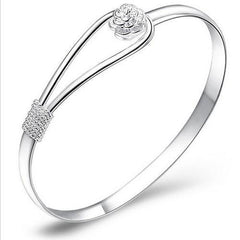 Silver bangle with flower detail