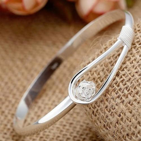 Silver bangle with flower detail