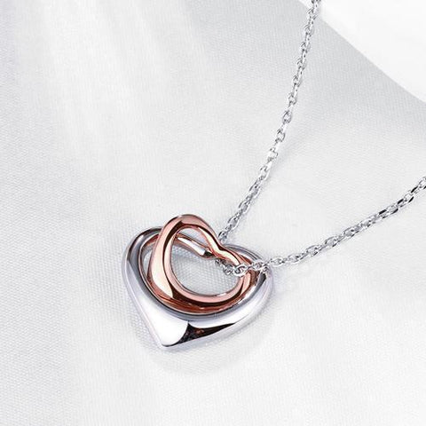 Necklace with heart pendants in white and rose gold