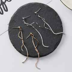 Spiral-shaped drop earrings in gold